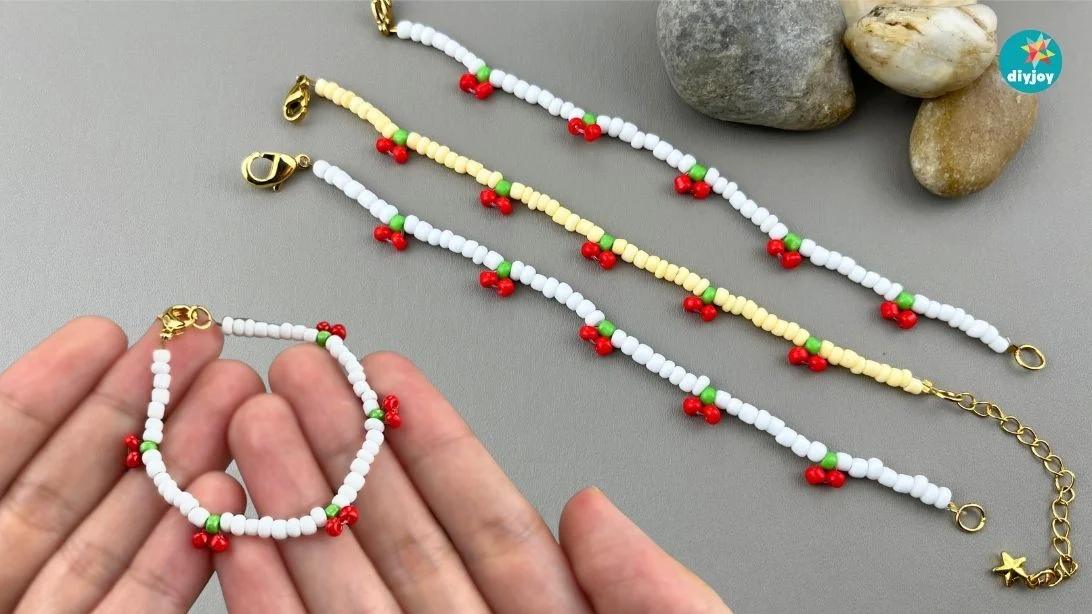 Cherry bead bracelet strung with tiny red and green seed beads shaped like fruit, a sweet DIY bead craft