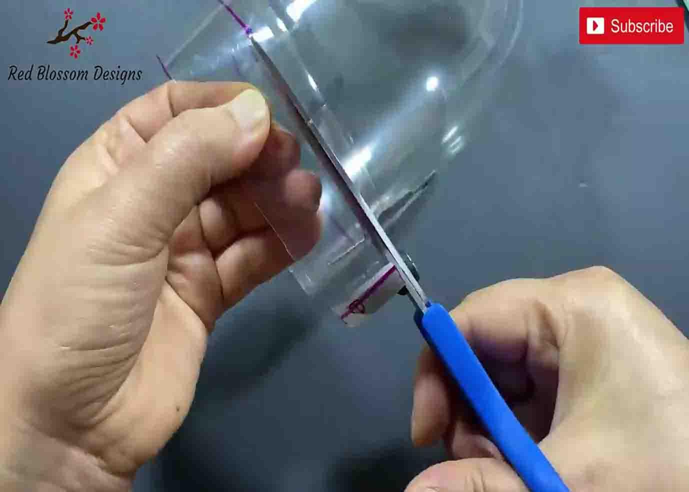 Cutting the plastic bottle for the bracelet