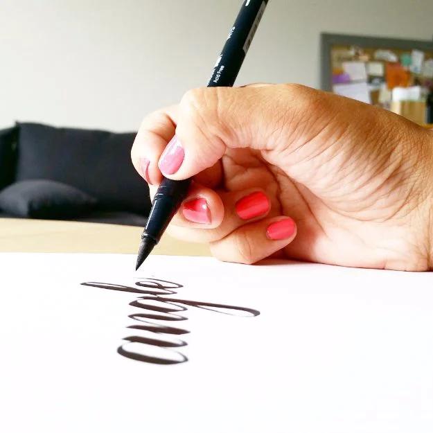Brush Lettering Tutorials - Hold Your Pen At An Angle - Simple and Fun Calligraphy Tutorial Videos - How To Paint the Alphabet in Calligraphy Handwriting with Pens, Watercolors, Ad