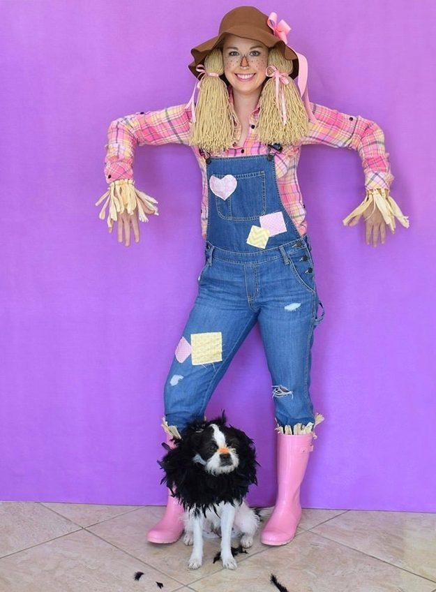 Scarecrow Halloween costume and makeup with an orange nose, freckles, a stitched smile, overalls and a straw hat