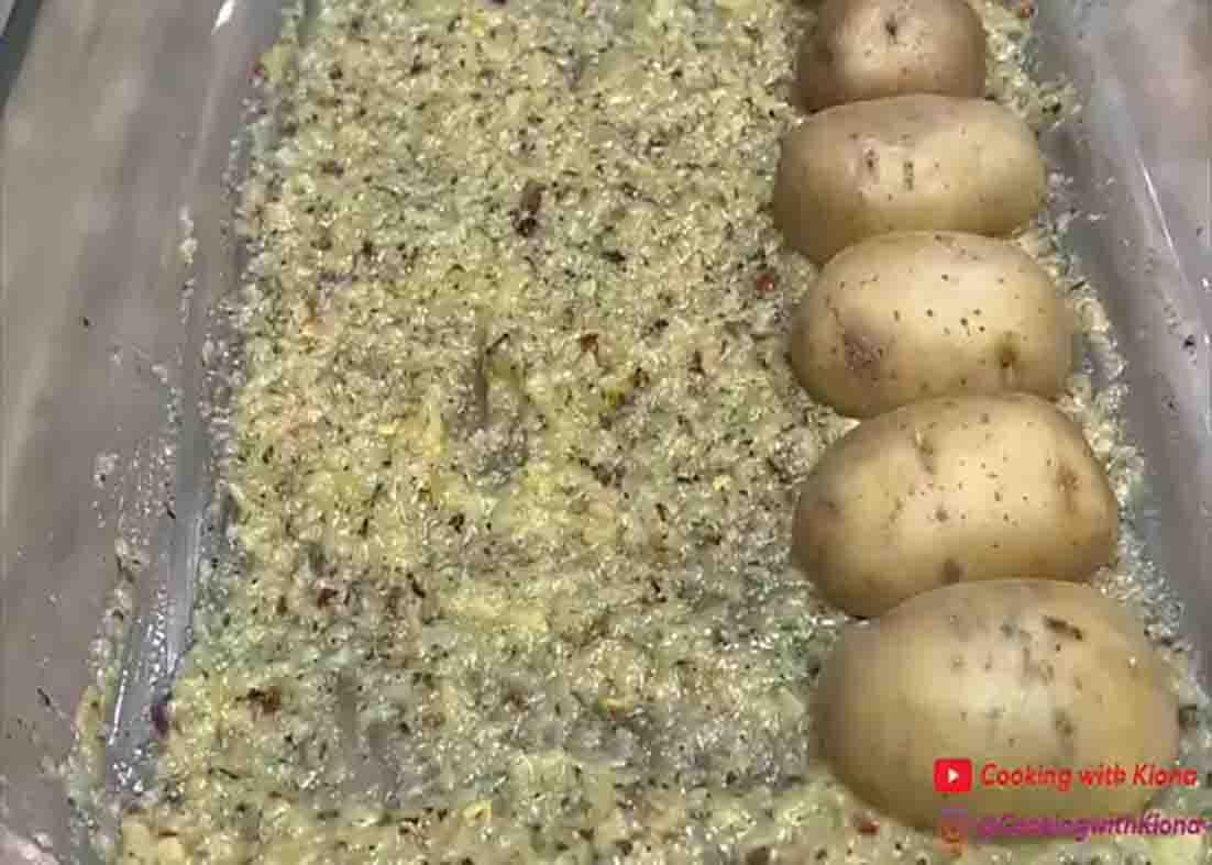 Placing the chopped potatoes in the casserole dish with the seasoning mixture
