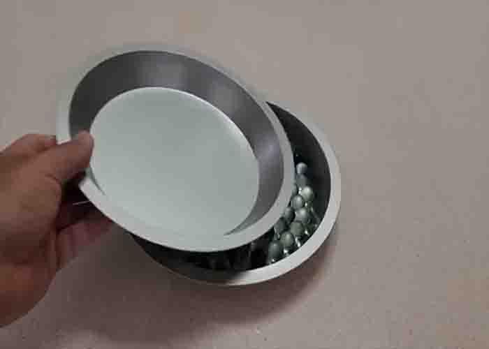 Making a DIY lazy susan for the herb bottles in the cabinet