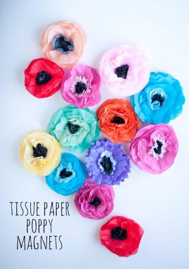 Tissue paper poppy magnets, red, pink, blue and purple tissue paper poppies with dark centers on white