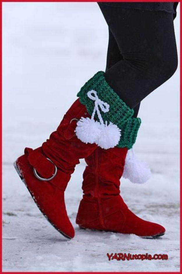 Festive pom boot cuffs, green and white crochet boot cuffs with white pom poms worn over red winter boots
