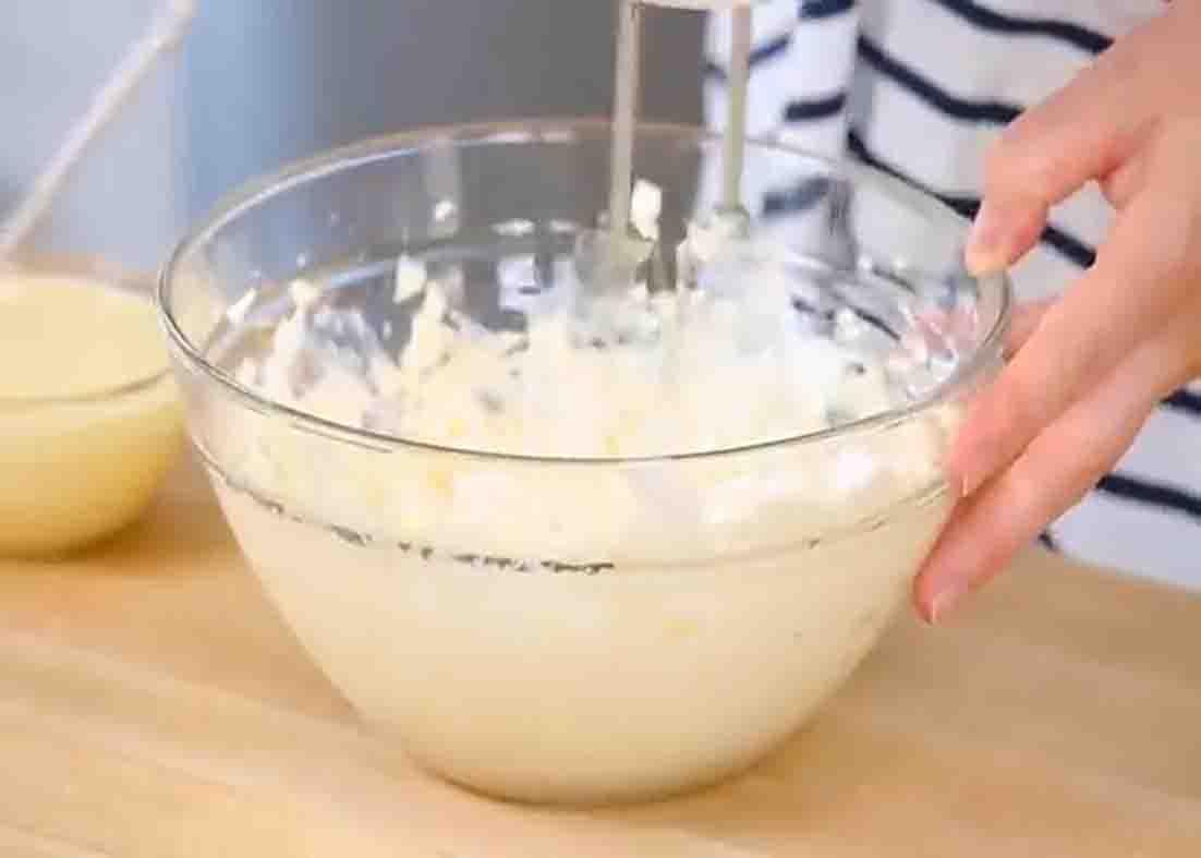 Whipping the cream cheese for the strawberry parfait recipe