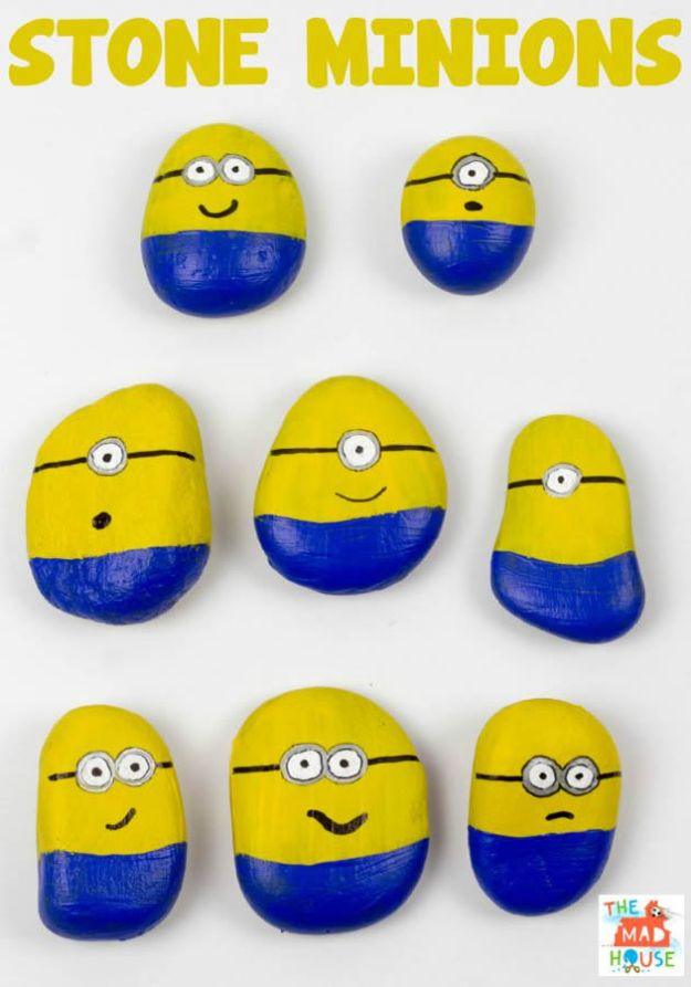 Eight smooth stones painted as yellow and blue minions with silver and black marker goggles, under a typeset title