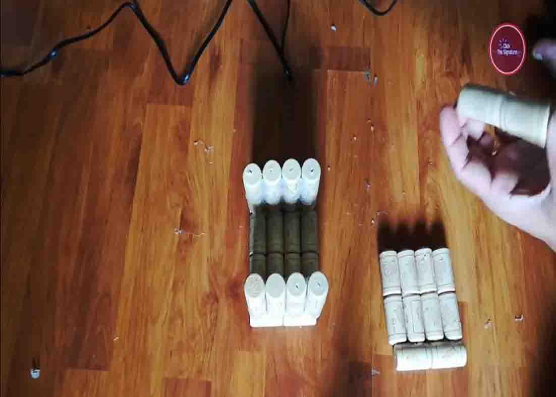 Assembling the cork pieces to create the flower vase