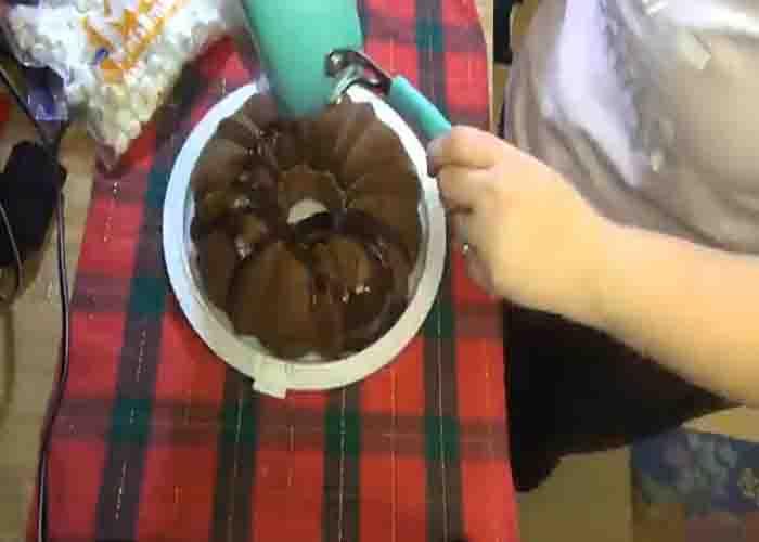 Decorating the peppermint hot chocolate cake