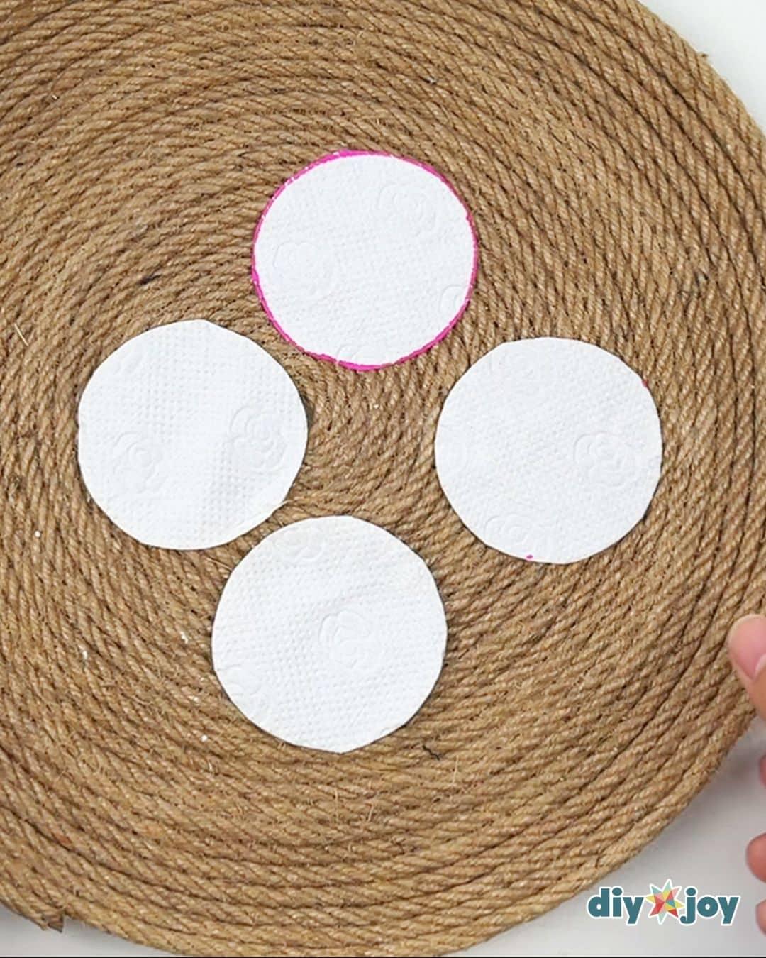 Cutting and separating step, scissors cutting layered tissue circles for an easy toilet paper flower craft