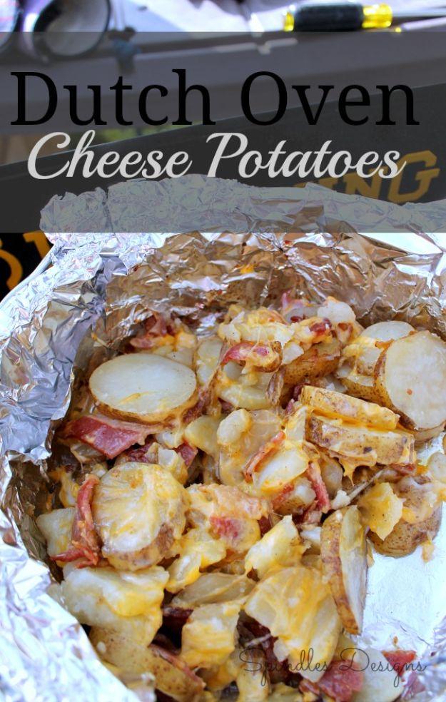 Dutch oven cheese potatoes layered with bacon, onion and butter, topped with melted shredded cheddar