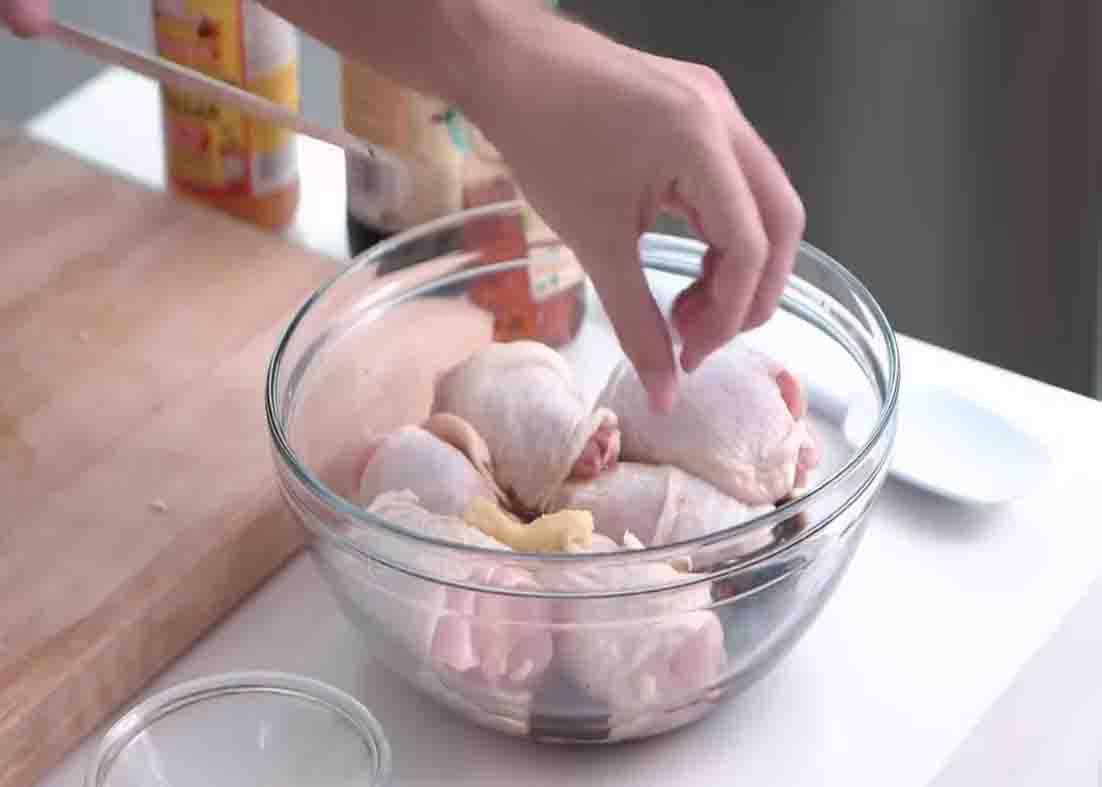 Marinating the chicken with soy sauce, honey, and apple cider vinegar