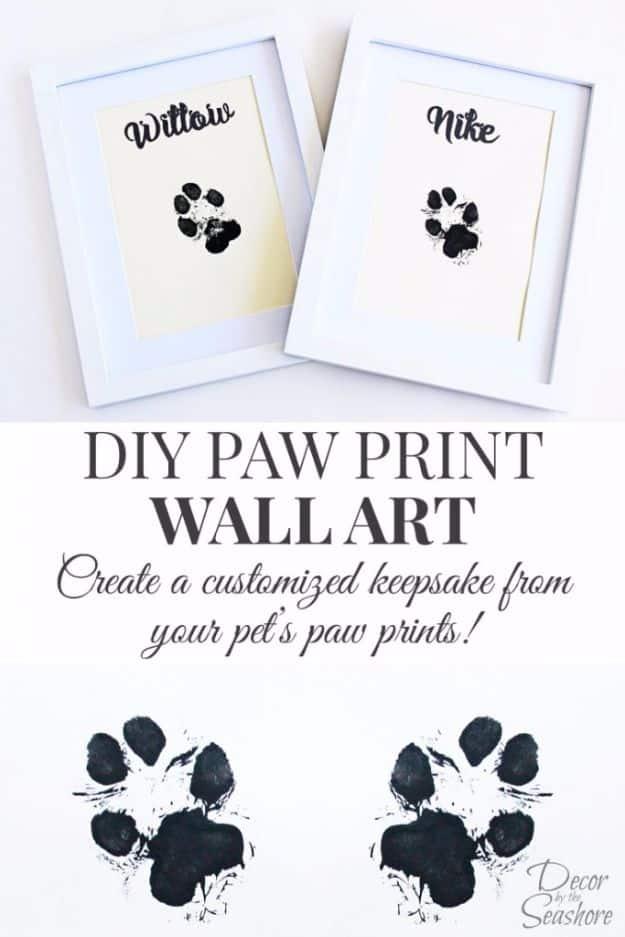 Collage titled DIY Paw Print Wall Art over two white frames of black paw prints, each lettered with a dog name