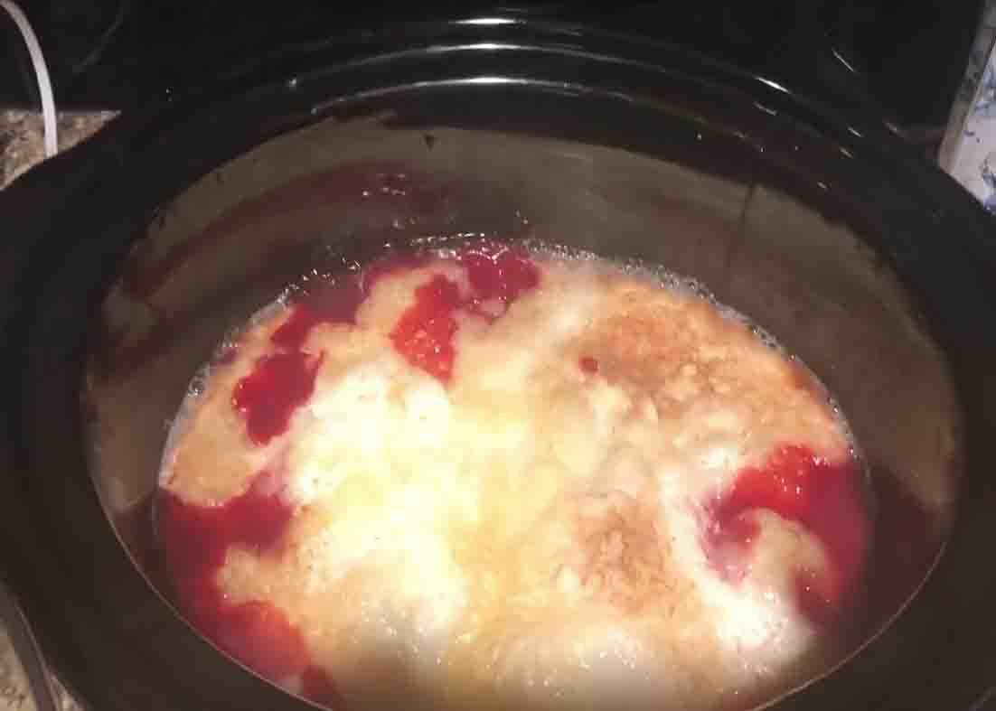 Checking the cherry cobbler if its already cooked through