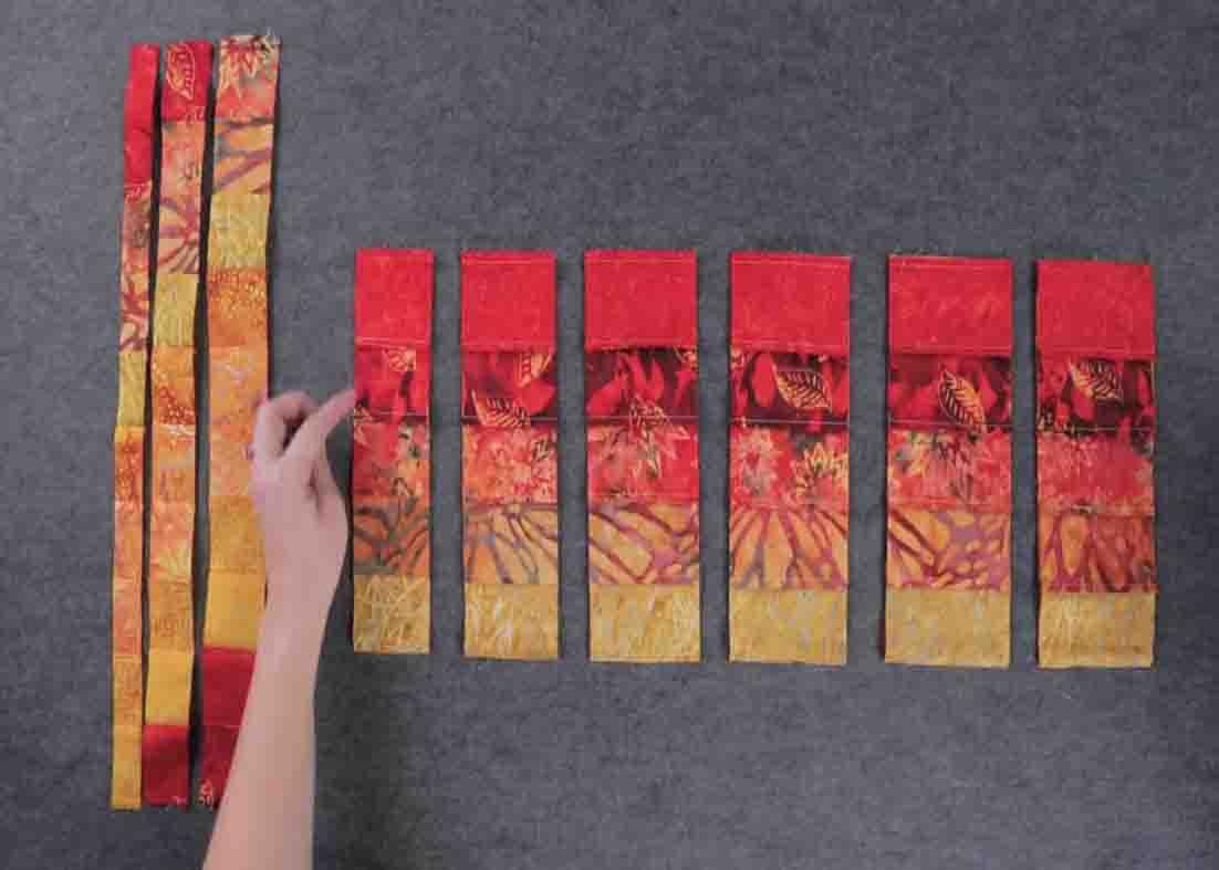 Piecing the strips together to make the bargello quilt