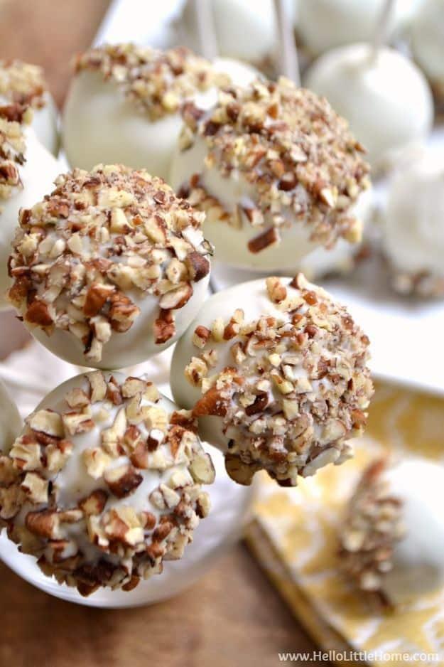 Pecan pumpkin spice cake pops dipped in chocolate and topped with chopped pecans for a fall dessert dessert table this year