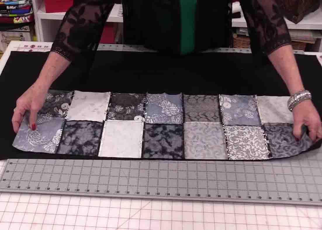 Lining the table runner and the backing fabric to their center