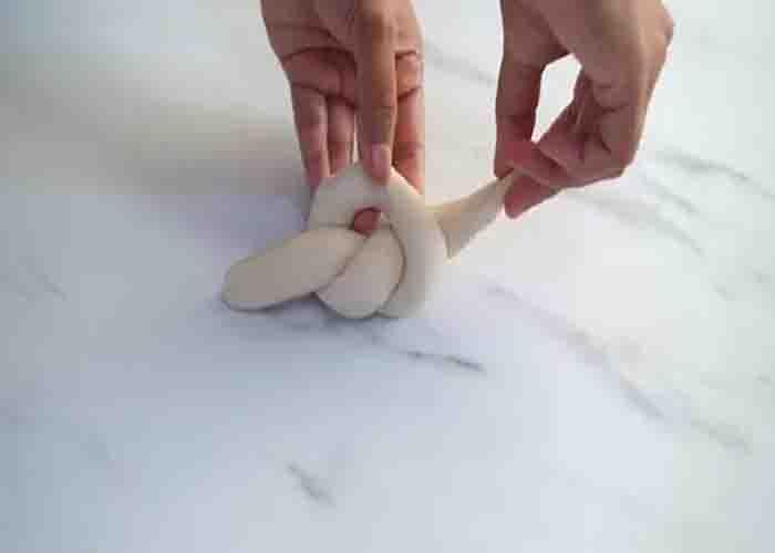Shaping the Kaiser dinner rolls