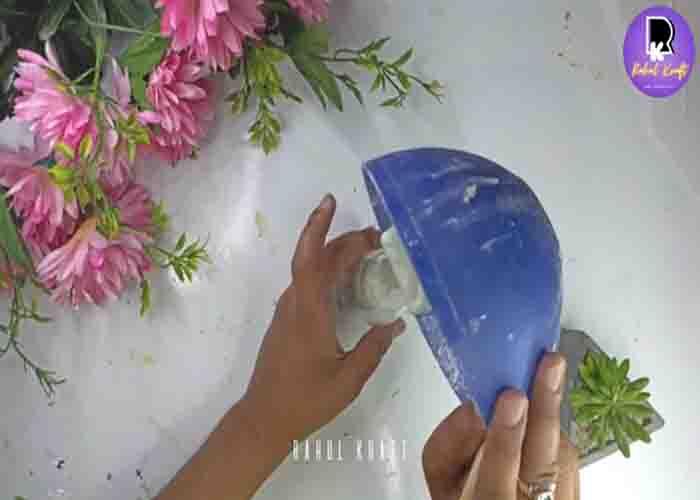 Molding the bottle into a cactus planter with cement