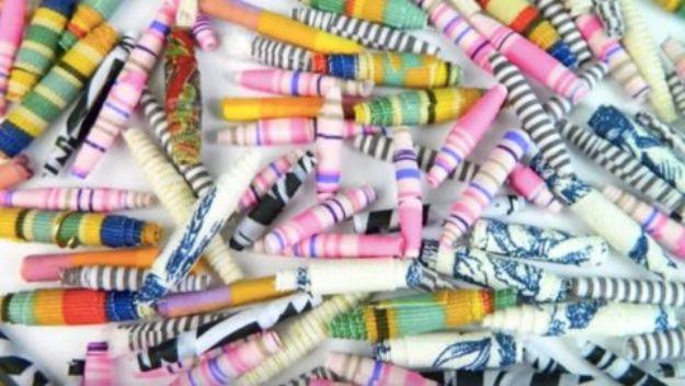 Fabric beads rolled from scrap fabric into colorful textured beads for jewelry, garlands, or seasonal decor