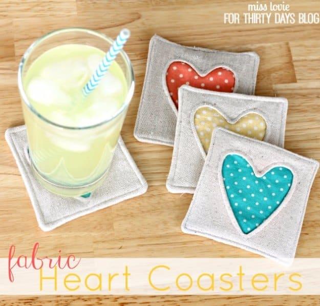 Simple fabric heart coasters, a beginner home sewing project with appliqued hearts beside a glass of lemonade