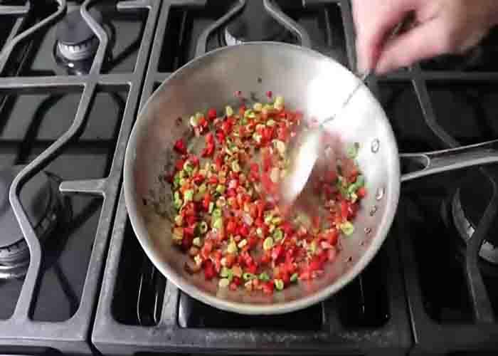 Sauteing the onions and peppers for the breakfast potatoes