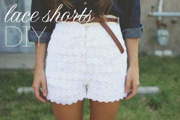 Layered lace shorts, white scalloped lace shorts worn with a denim shirt and a brown belt against a pale wall