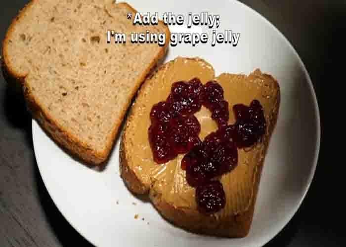 Spreading peanut butter and jelly on the bread
