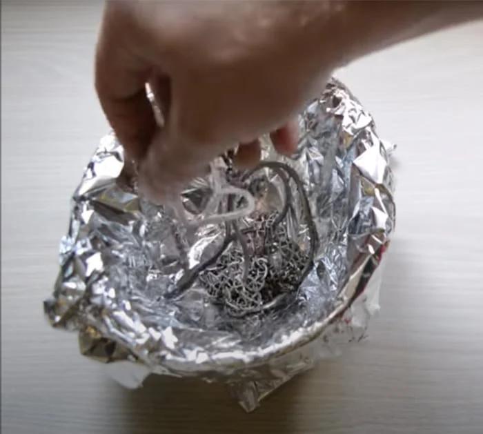 use foil and sofa to clean silver