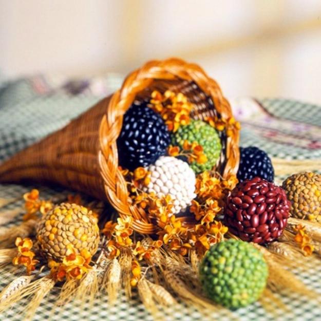 Abundance seed balls sitting in a shallow bowl as a natural Thanksgiving table decoration and guest favor