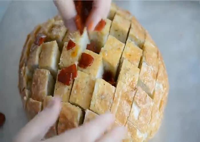 Assembling the pepperoni pizza party bread
