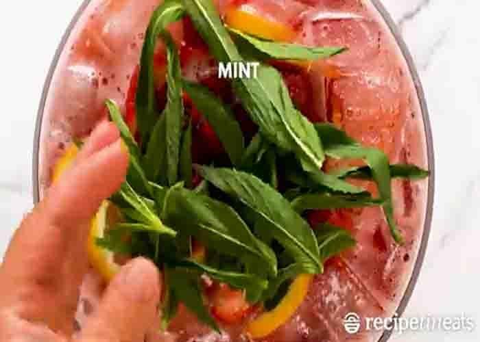 Adding the fruits to the celebration punch