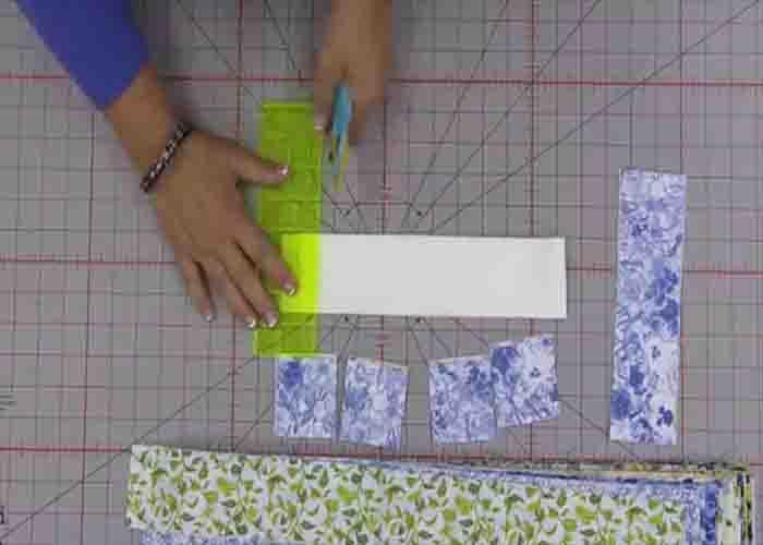 Subcutting the fabric to make the geese unit for the flying home quilt