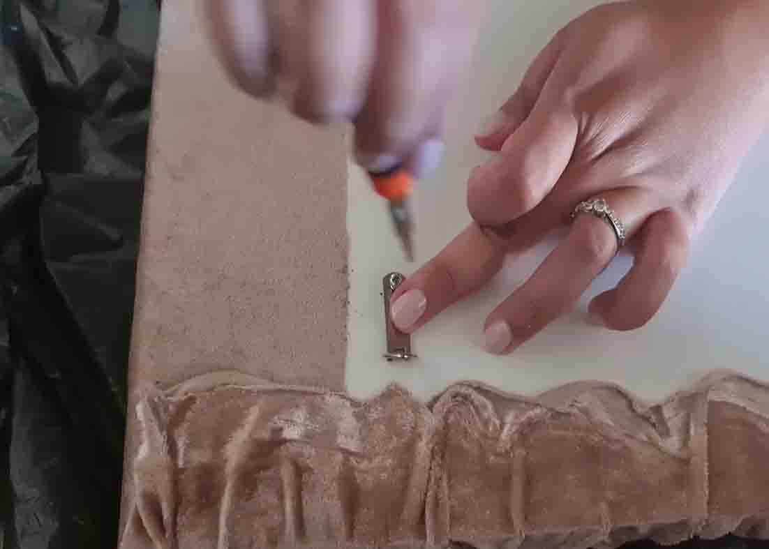 Attaching the hooks on the back of the DIY pool noodles headboard