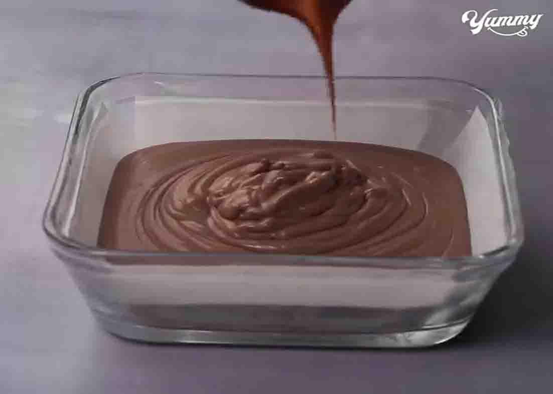 Pouring the yogurt mousse mixture in the pan