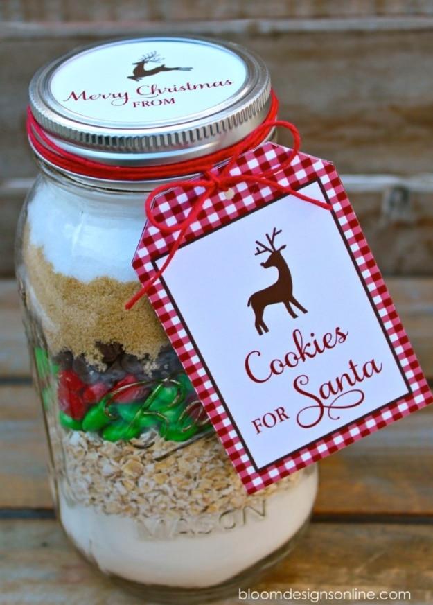 Large quart mason jar of layered cookie mix with a red gingham Cookies for Santa gift tag on the lid