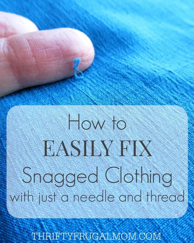 Clothing repair hack for snags, a fingertip lifting a pulled loop of thread from bright blue woven fabric
