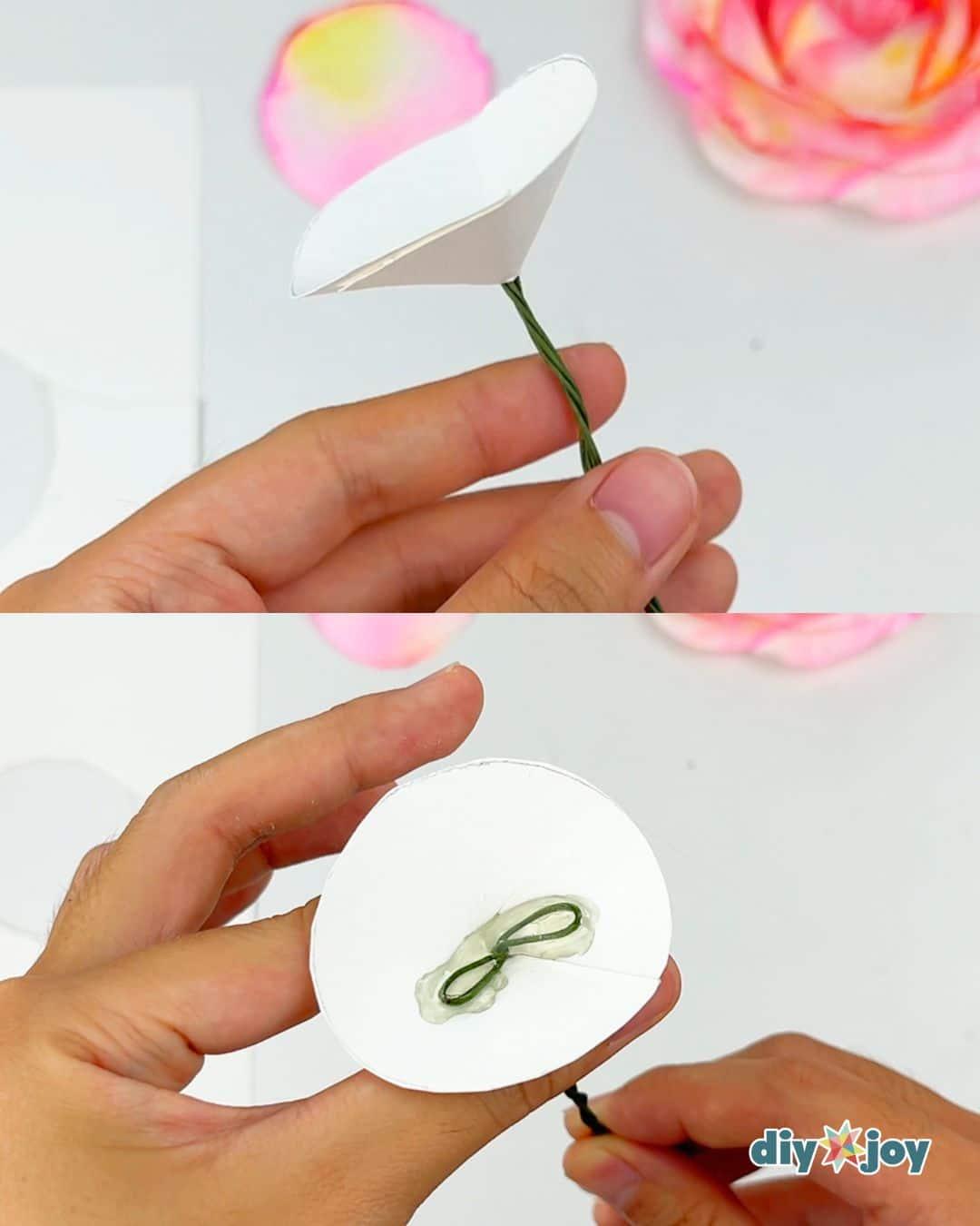 Budget friendly DIY paper flowers made from toilet paper and markers, finished roses on a plain surface