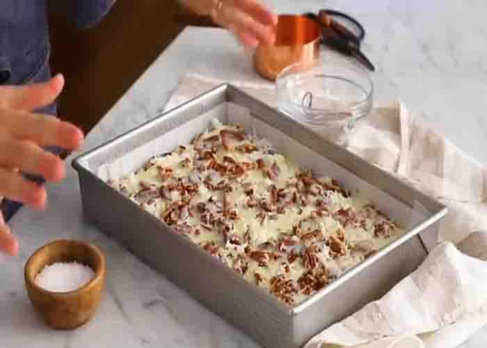 Assembling the magic cookie bars