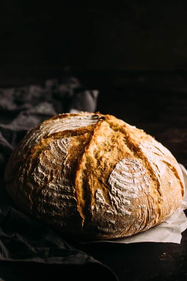 Easy crusty French bread baked in a Dutch oven with a deeply browned crackled crust and a soft interior