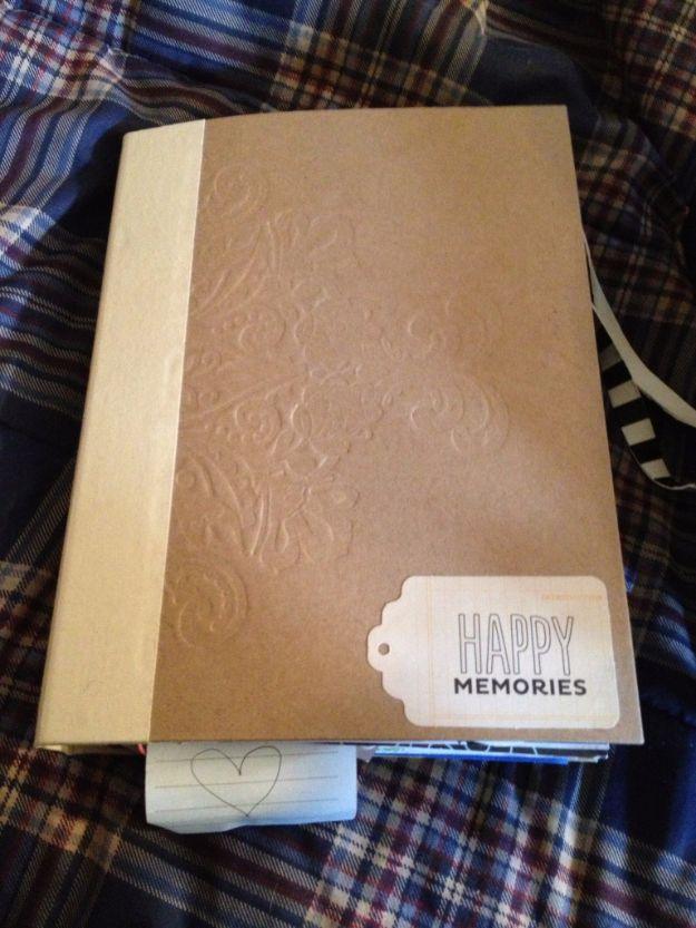 A scrapbook stuffed with photos, ticket stubs and notes telling the story of a couple, a handmade gift