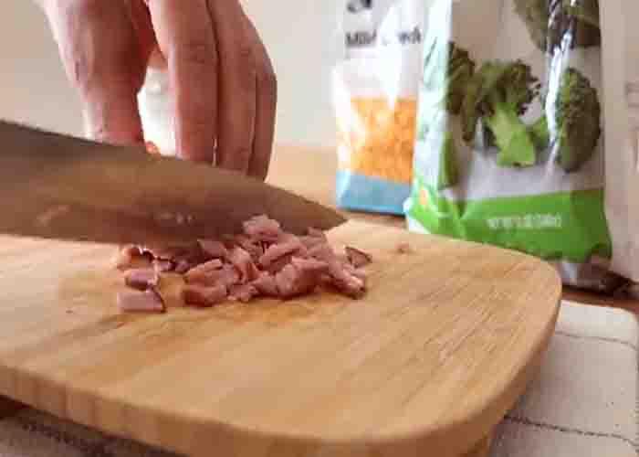 Chopping the deli ham for the quiche toast cups