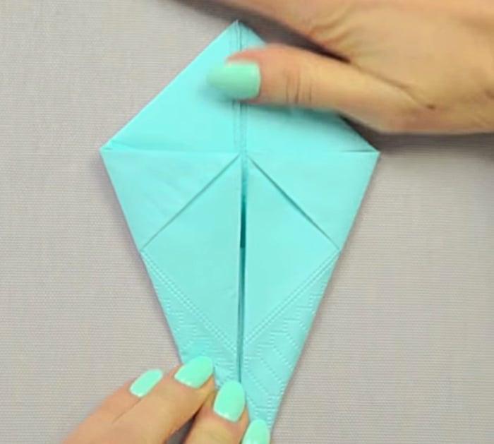 Learn a paper napkin folding technique to make a bunny