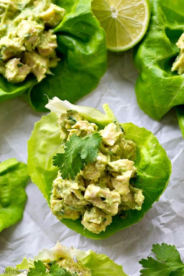 Avocado chicken salad lettuce wraps in crisp butter lettuce leaves with red onion, lime and cilantro