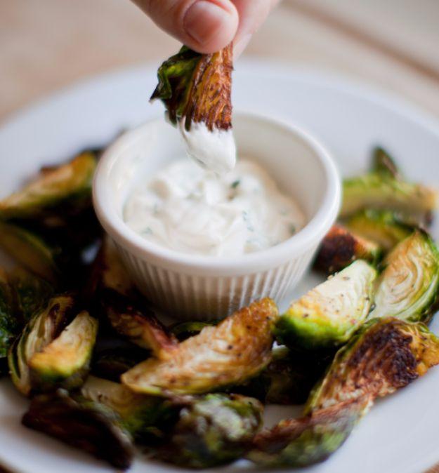 Crispy brussels sprout wedges roasted golden and served around a small ramekin of garlic parsley aioli
