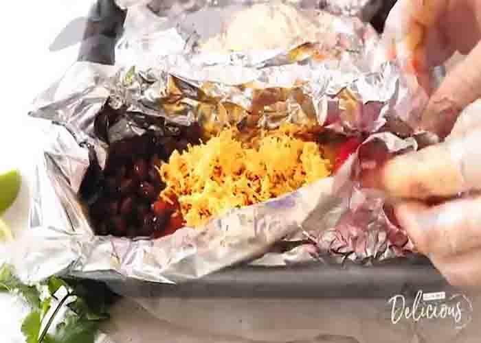 Assembling the chicken and rice foil packets