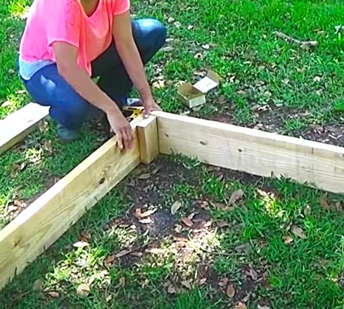 Use Long Wood Screws To Bolt Together A Wooden Raised Garden Bed