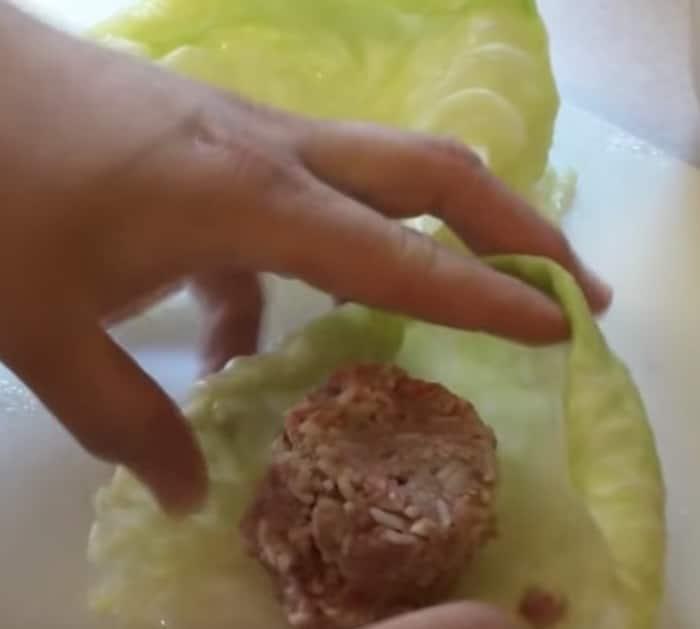 Make crockpot stuffed cabbage rolls with sausage and rice