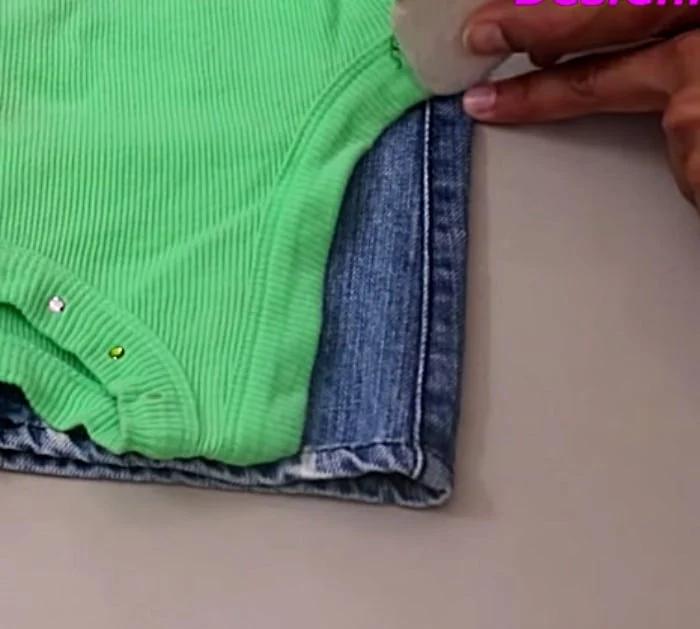 Make a long denim woman's vest out of a large pair of men's jeans