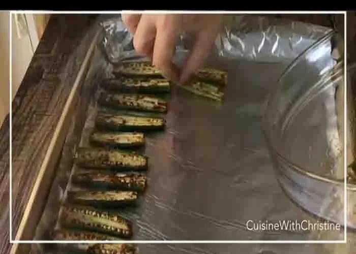 Laying the okras in the baking sheet