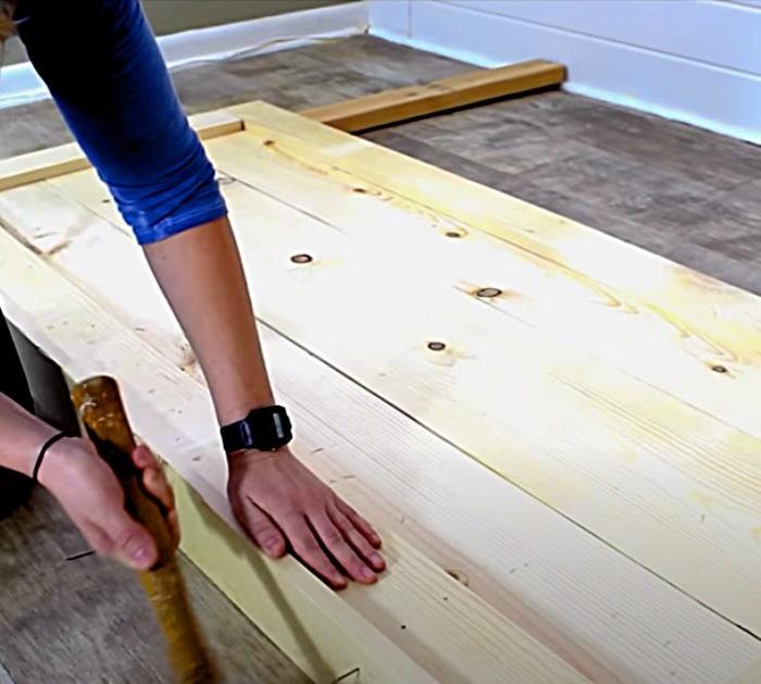 Try this rustic farmhouse head board made with twenty dollars worh of wood from Home Depot